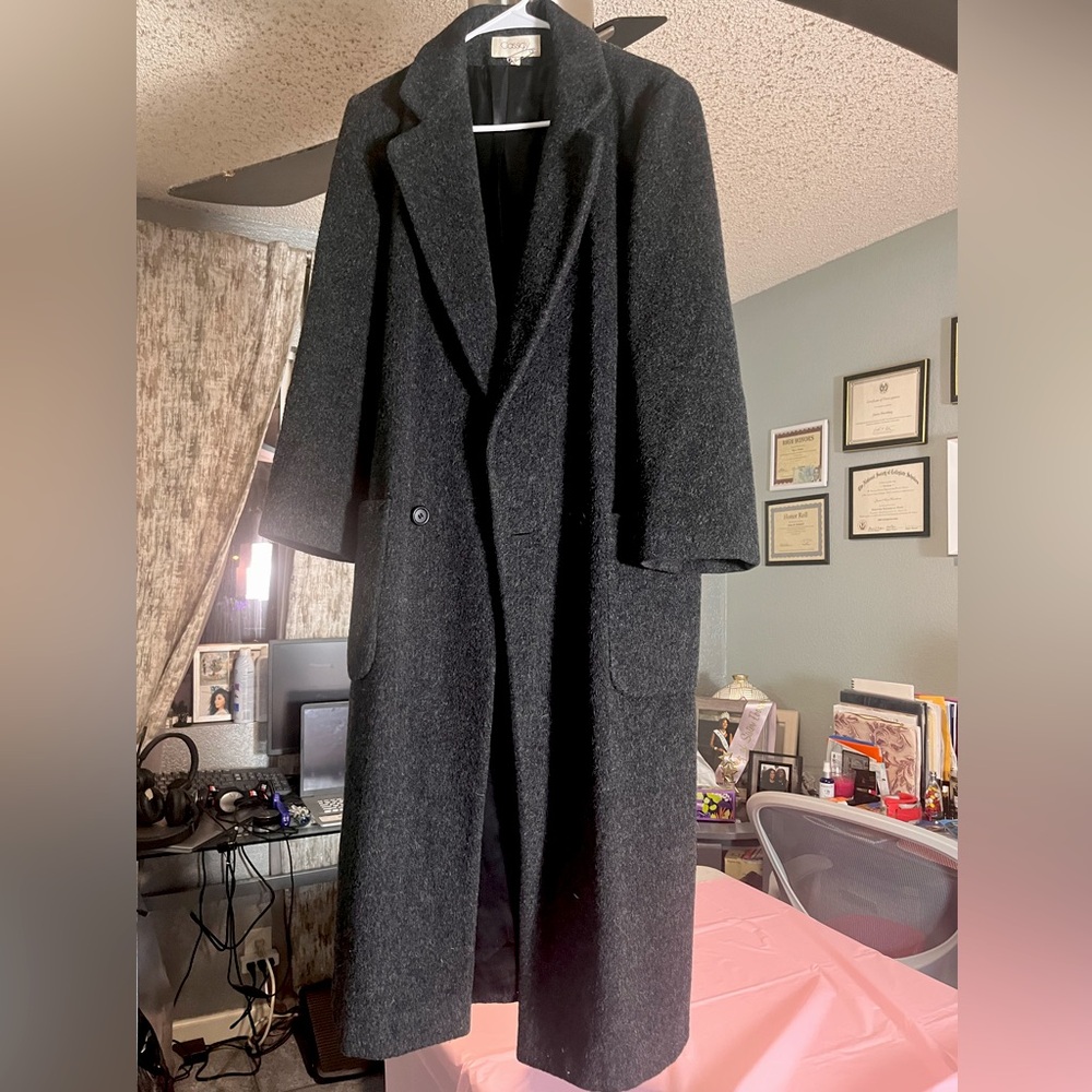 this piece is a long coat with a grayish color